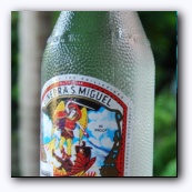 Местный джин, "made of sugarcane alcohol and select imported substances obtainable"